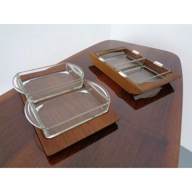 Teak-made tray and stand with two glass bowls from the 1960s. This piece has an attribution mark, I am sure that it is...