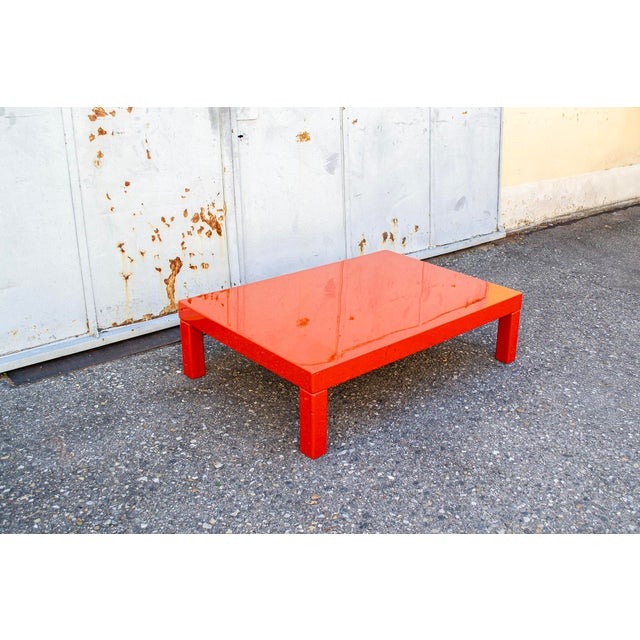 Coffee table in orange lacquered wood. Made in Italy 1970s