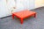 Coffee table in orange lacquered wood. Made in Italy 1970s