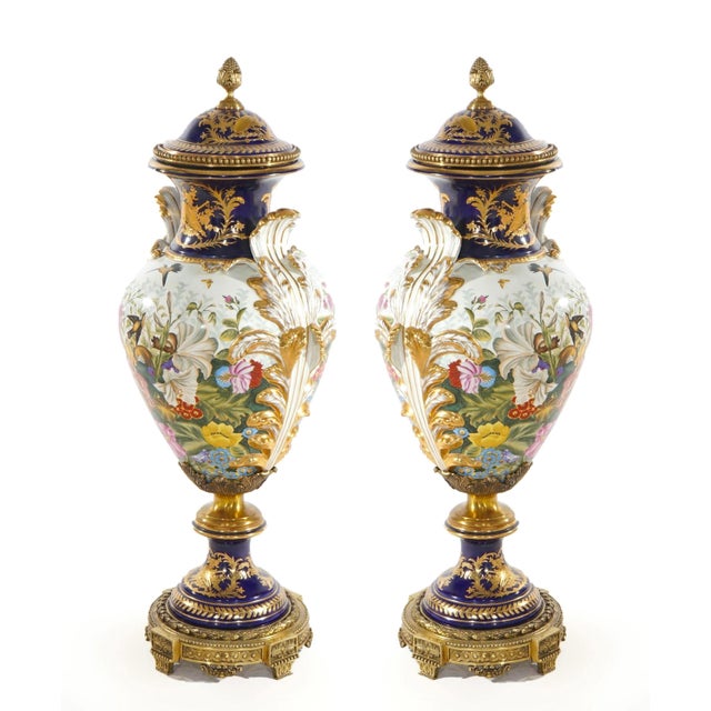 An extraordinary and monumental 19th century French Sèvres porcelain centerpiece covered urn or vase, crafted in France...