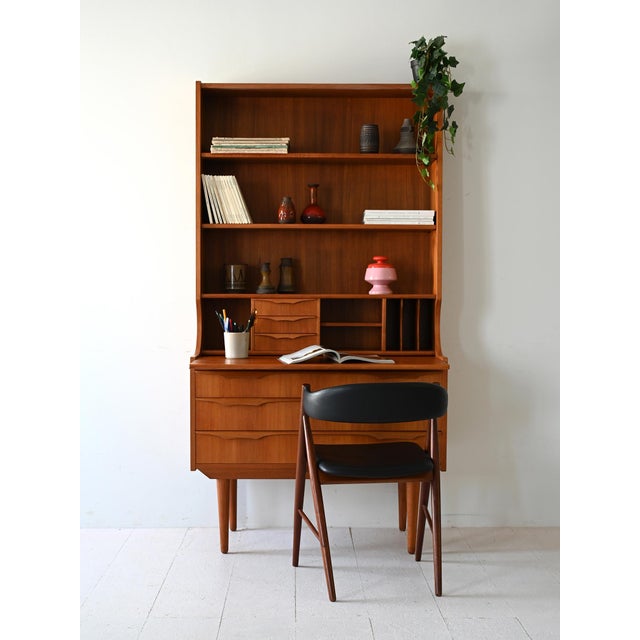 1950s piece of teak furniture with three drawers, interlocking flap, three shelves and compartments with drawers and card...