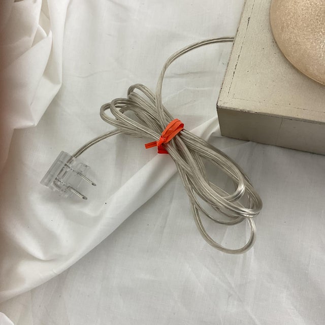 Striking architectural, this elegant pair of table lamps features vertically stacked Lucite elements arranged in a...