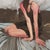 All Roads Lead Home by Michael Carson | Oil on Panel Woman sitting on a bed with soft bedding. For Sale - Image 4 of 5