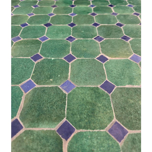 Beautiful handcrafted Moroccan mosaic table featuring an elegant turquoise and blue color palette. Measuring 40 inches in...