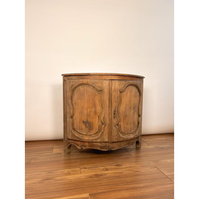 Late 19th century French LXV style corner cabinet crafted from solid walnut. Featuring elegant curved lines, hand-carved...