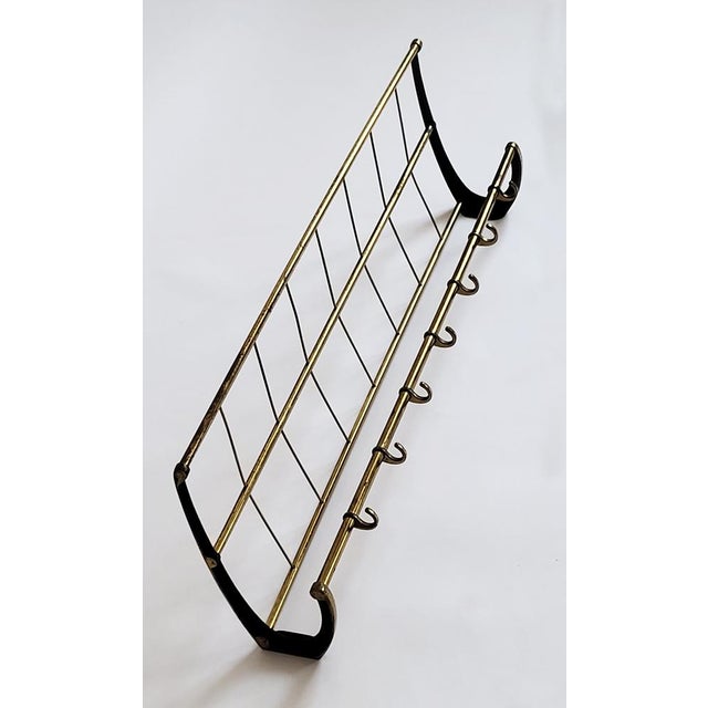 A sculptural, functional piece of mid-century design from the 1950s, space-saving and practical. Made in Austria. This...