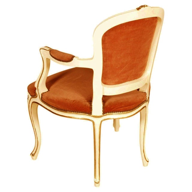 Elegant venetian armchair in the louis xv taste, distinguished by a finely shaped wooden frame finished in ivory lacquer...