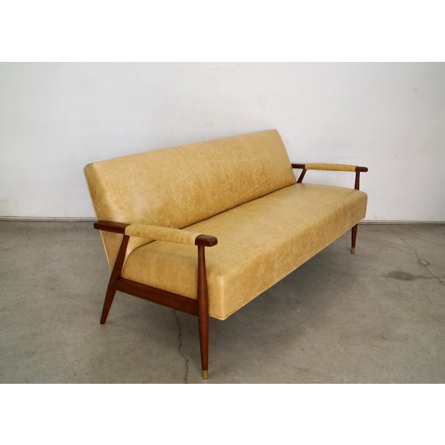 Vintage 1950's Mid century Modern lounge couch for sale. It has been professionally restored, and is in excellent...
