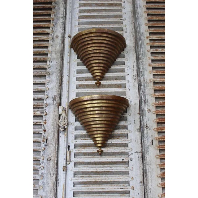 A lovely pair of Venetian style wall brackets that feature an elegant stepped curved triangular design with a bottom...