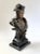 Finely cast bronze bust of Napoleon Bonaparte wearing his iconic bicorne hat, modeled with expressive detail and mounted...