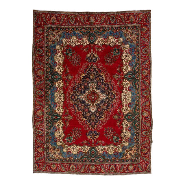 This Vintage Handmade Persian Tabriz Wool Rug in a Rich Red With a Rosette Motif For Sale