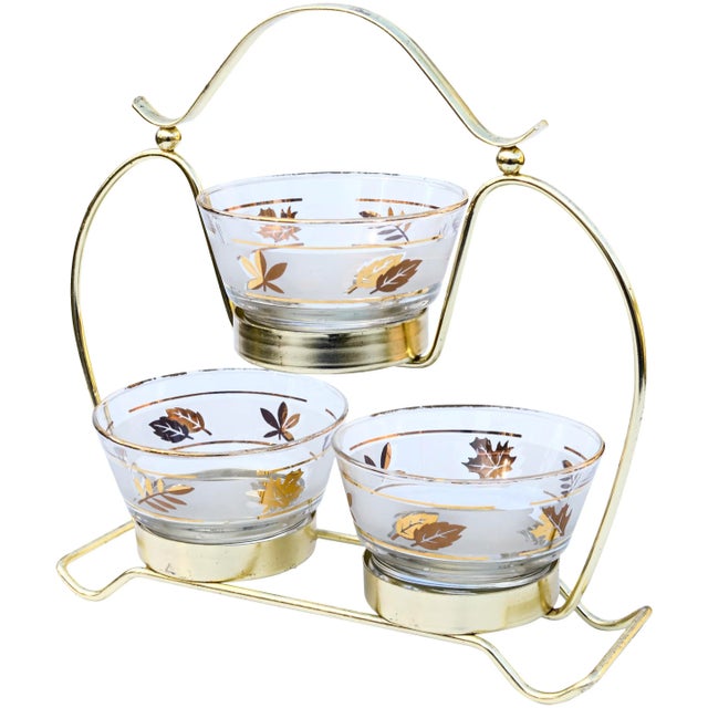 Beautiful set of three midcentury glass bowls with hand-painted leaf pattern, ornate golden rims and fine details, housed...