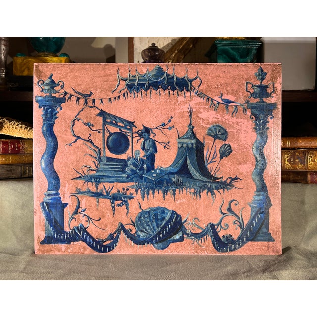 French Chinoiserie decorative oil on wood panel painting. It features a whimsical, blue monochrome scene often called...