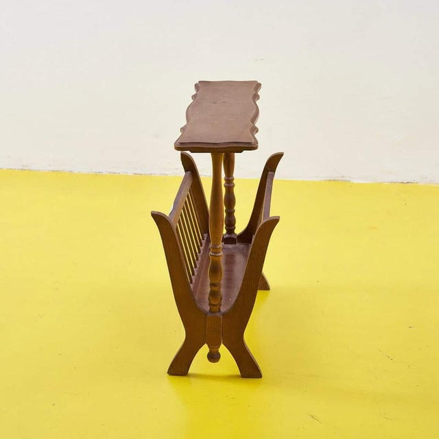 Item : discover the timeless charm of this vintage wooden magazine rack, a piece of furniture that combines functionality...