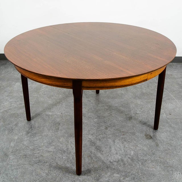 Stunning Danish modern round dining table in Brazilian rosewood. Unique and well made, this table is a great addition to...