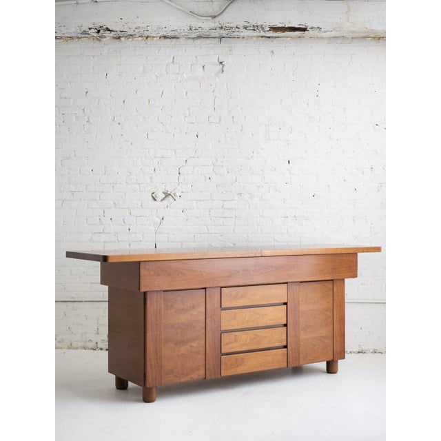 A late mid century Italian sideboard / credenza attributed to Mobil Girgi. A heavy and substantial wood piece featuring...