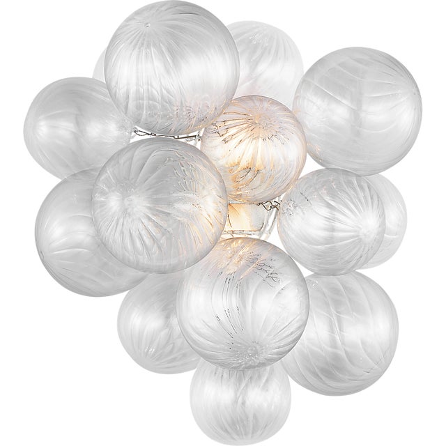 Description: Artisanal glass elevates the Talia series by Julie Neill, offering a new take on the simple glass globe light...