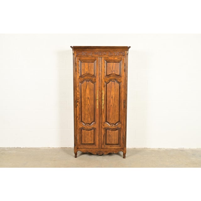 A gorgeous French Provincial Louis XV style armoire dresser, gentleman's chest, or linen press By Baker Furniture USA,...