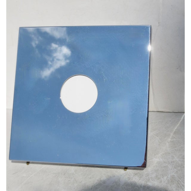 Chrome-faced Italian photo frame with circle window. Marked to the back: Felice Antonio, Botta, Firenze /Made in Italy....