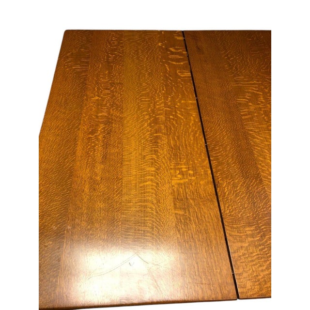 The Victorian Tiger Oak Heavy Carved Dining Table and 4 Leaves is a stunning antique piece crafted from solid oak with...
