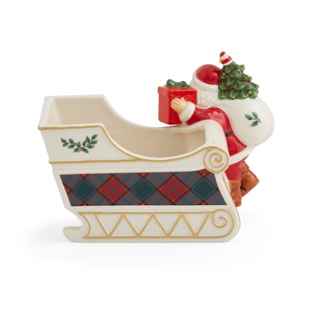 This Figural Santa Sleigh Candy Jar features a jolly Santa with a sack of gifts ready for delivery, aside his sleigh...