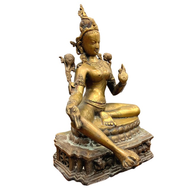 Type: Buddhist statue, Bodhisattva Tara Material: brass/bronze Color: gold Decoration: the bodhisattva is depicted in a...