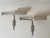 A refined pair of adjustable wall lights by Florian Schulz, Germany, dated March 1993. Executed in nickel-plated metal,...