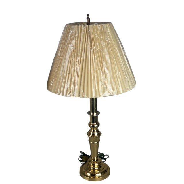 Matching pair of solid polished brass candlestick-style table lamps with classic turned baluster columns, knops, rings,...