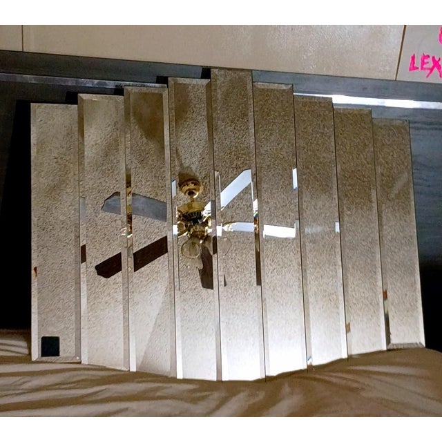 Stunning vintage Postmodern "Neo Deco" statement wall mirror from the 1980s. Features a striking, architectural waterfall...