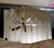 Stunning vintage Postmodern "Neo Deco" statement wall mirror from the 1980s. Features a striking, architectural waterfall...