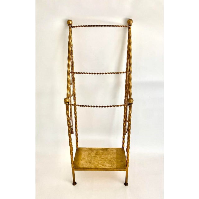 From the estate of a prominent world traveler, this gilt standing towel rack will add drama to any bathroom. Or consider...