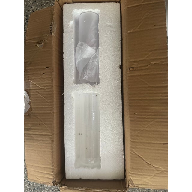 Straight arms hold metal, vertical clear glass shades. Width 20" Rating Damp Rated Shade Details Glass Clear Height 4.5"...