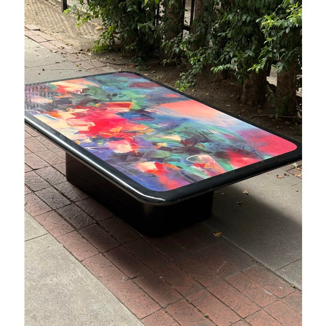 Colorful and unique lacquered pedestal coffee table signed by artist Ron Kemper, likely 1980s or early 90s. Featuring an...