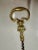Early 1900s Solid Brass cork screw bottle opener. The handle has a monkey. Measuring 6” long.