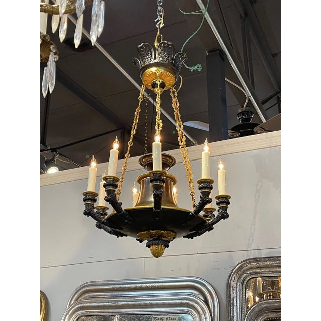Fine quality 19th century French Empire gilt bronze 9-light chandelier. Circa 1870. The chandelier has been professionally...