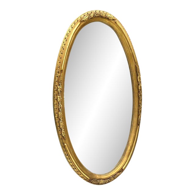 Oval Wall Mirror With Floral Center Detail & Gold Leaf Frame For Sale