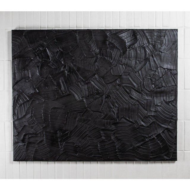 A captivating exploration of depth and dimension, this abstract textural painting by Michael Allen is a striking statement...