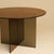 The Sado is a bronzed glass dining table, a study in transparency built from Italian glass rather than stone. It trades...