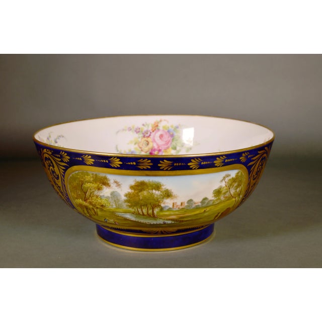 Samson Porcelain Mazarine Blue-Ground Punch Bowl with London View and Botanical Interior, in the Derby Style Edmé Samson...