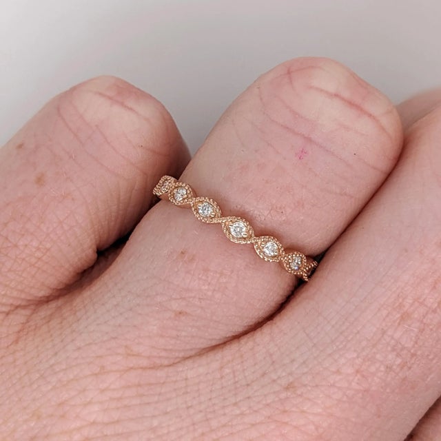 This is an eternity diamond band ring in which the diamonds extend all the way around the band. This dainty diamond band...