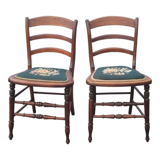 A Pair of Early 20th Century Victorian Style Ladder Back Walnut and Needlepoint Upholstered Seat Side Chairs For Sale