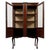 An elegant early 20th-century English display cabinet, finely crafted from mahogany and distinguished by delicate...