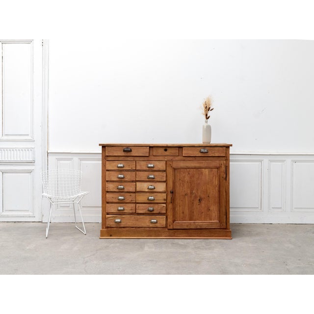 This vintage workshop cabinet dates back to the 1930s and has stood the test of time, retaining all its character. Its 14...