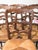 This delightful set of six oak dining chairs features classic rush seats that remain in good vintage condition. The...