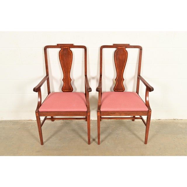 A gorgeous pair of Federal or Hepplewhite style armchairs or dining captain chairs In the manner of Baker Furniture USA,...
