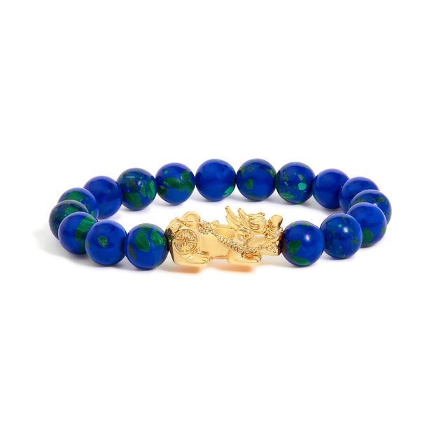Slip this celestial strand over your wrist and feel the quiet power of earth and legend. Seventeen natural azurite beads,...