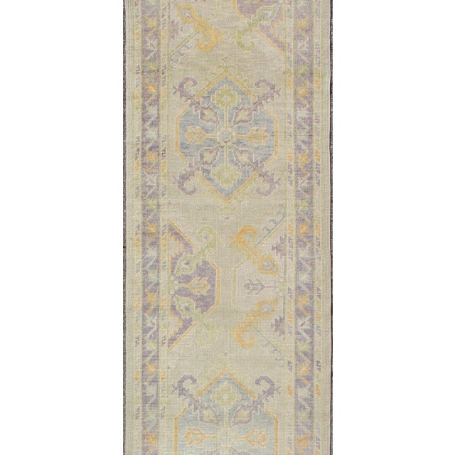 Turkish Oushak runner with purple, blue and L.Green colors and all-over Tribal design. Keivan Woven Arts / rug EN-165660,...