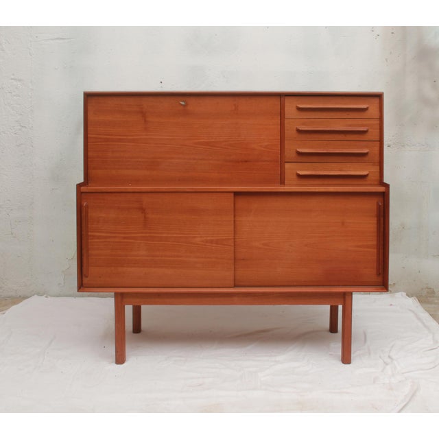 Classic 1960s sideboard and secretary desk combination. Lower section with sliding doors, upper section with an integrated...