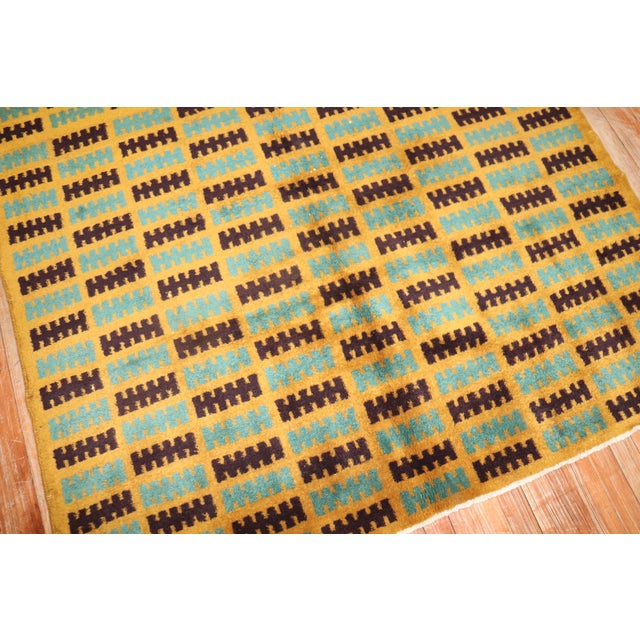 A handmade midcentury Turkish retro style rug from the third quarter of the 20th century, Measures 4'9" x 5'4''.