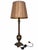 A decorative buffet-style table lamp combining a slender column with an urn-shaped lower body and a square architectural...
